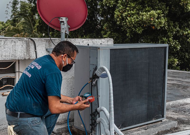 Technician repairing an air conditioning unit outdoors in Florida